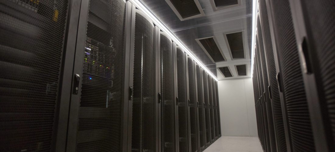Wide angle background image of server room hall with supercomputer in data center or research facility, copy space